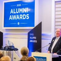 Bob Stoll shares remarks from the podium